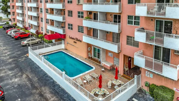 front view of multiple houses with a yard