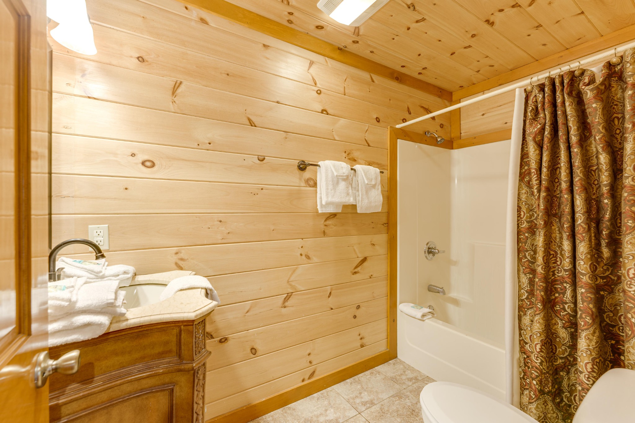 216 Amet Way Cosby, TN 37722 - Photo 16 of 21 a bathroom with a sink toilet and shower