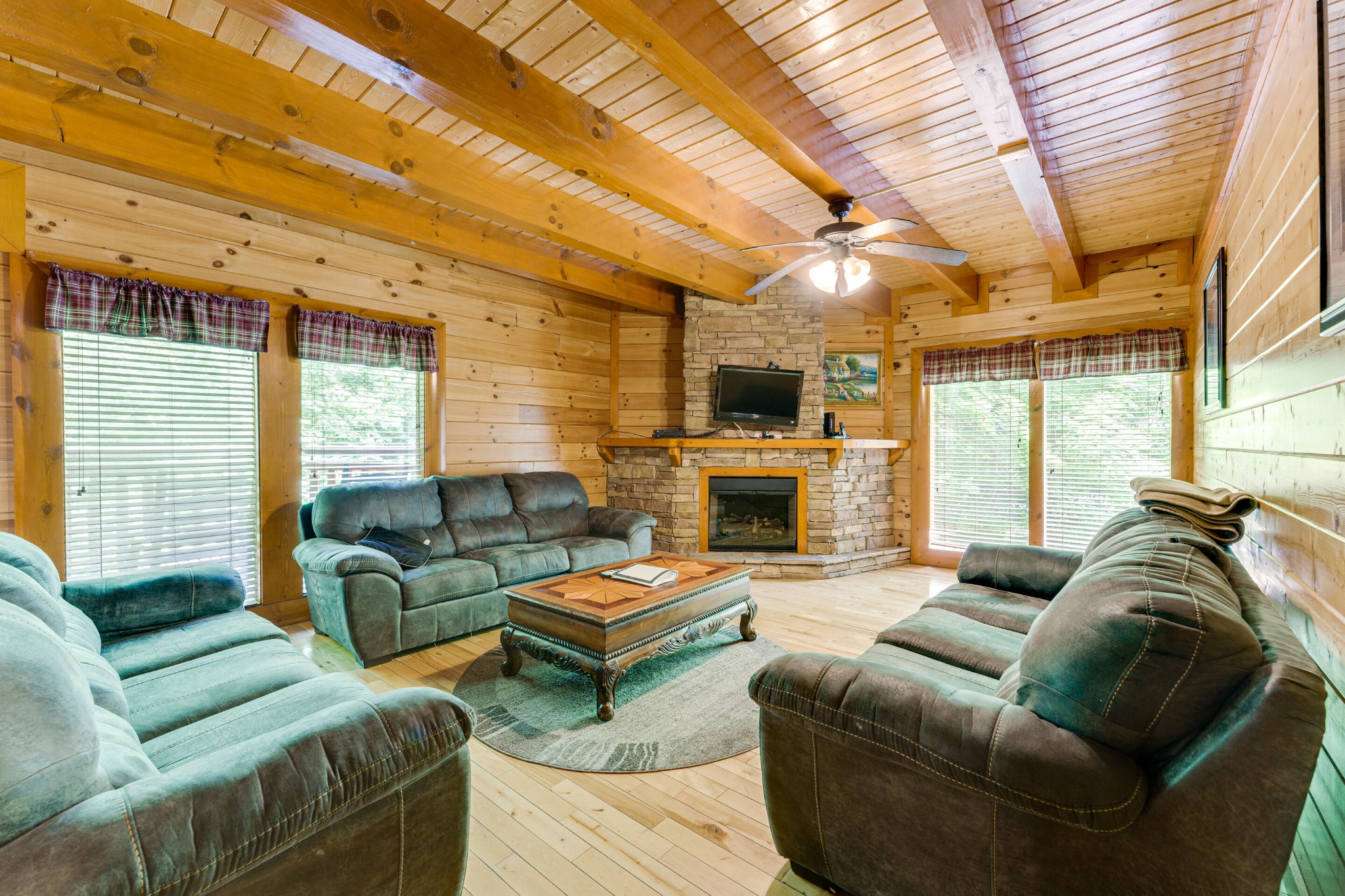 216 Amet Way Cosby, TN 37722 - Photo 4 of 21 a living room with furniture a fireplace and a table