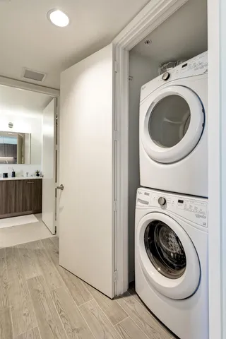 a view of a hallway with washer and dryer