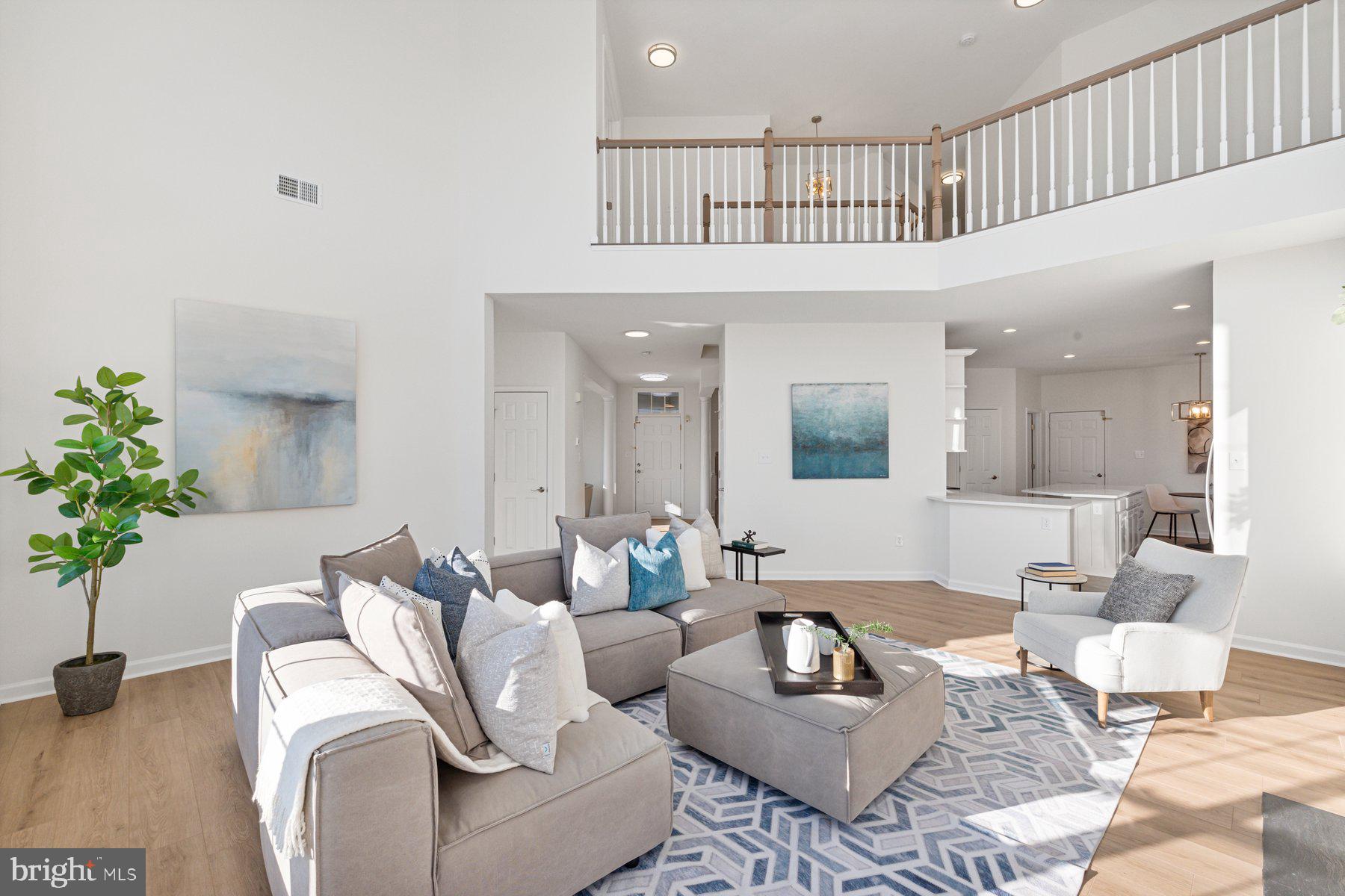 8329 Tillett Loop Manassas, VA 20110 - Photo 11 of 27 a living room with furniture and a potted plant
