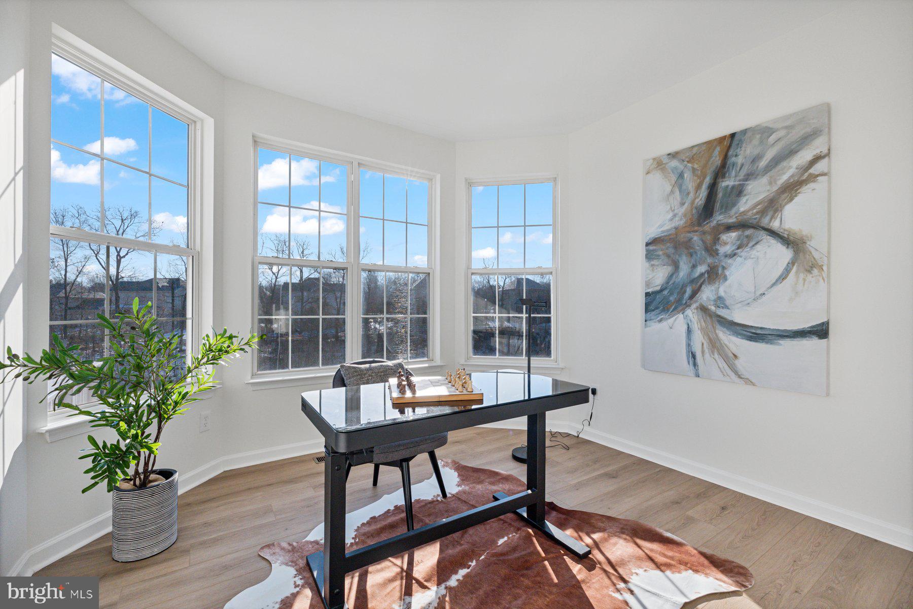 8329 Tillett Loop Manassas, VA 20110 - Photo 14 of 27 a dining room with furniture and wooden floor