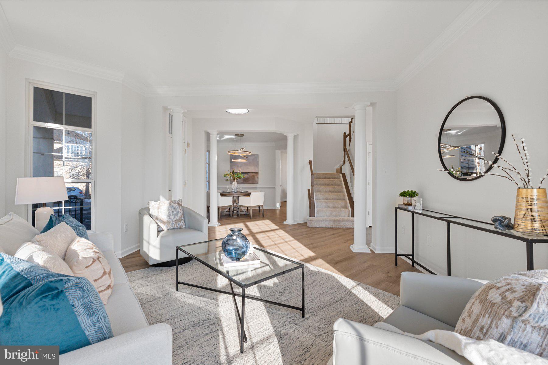 8329 Tillett Loop Manassas, VA 20110 - Photo 15 of 27 a living room with furniture a rug and a window