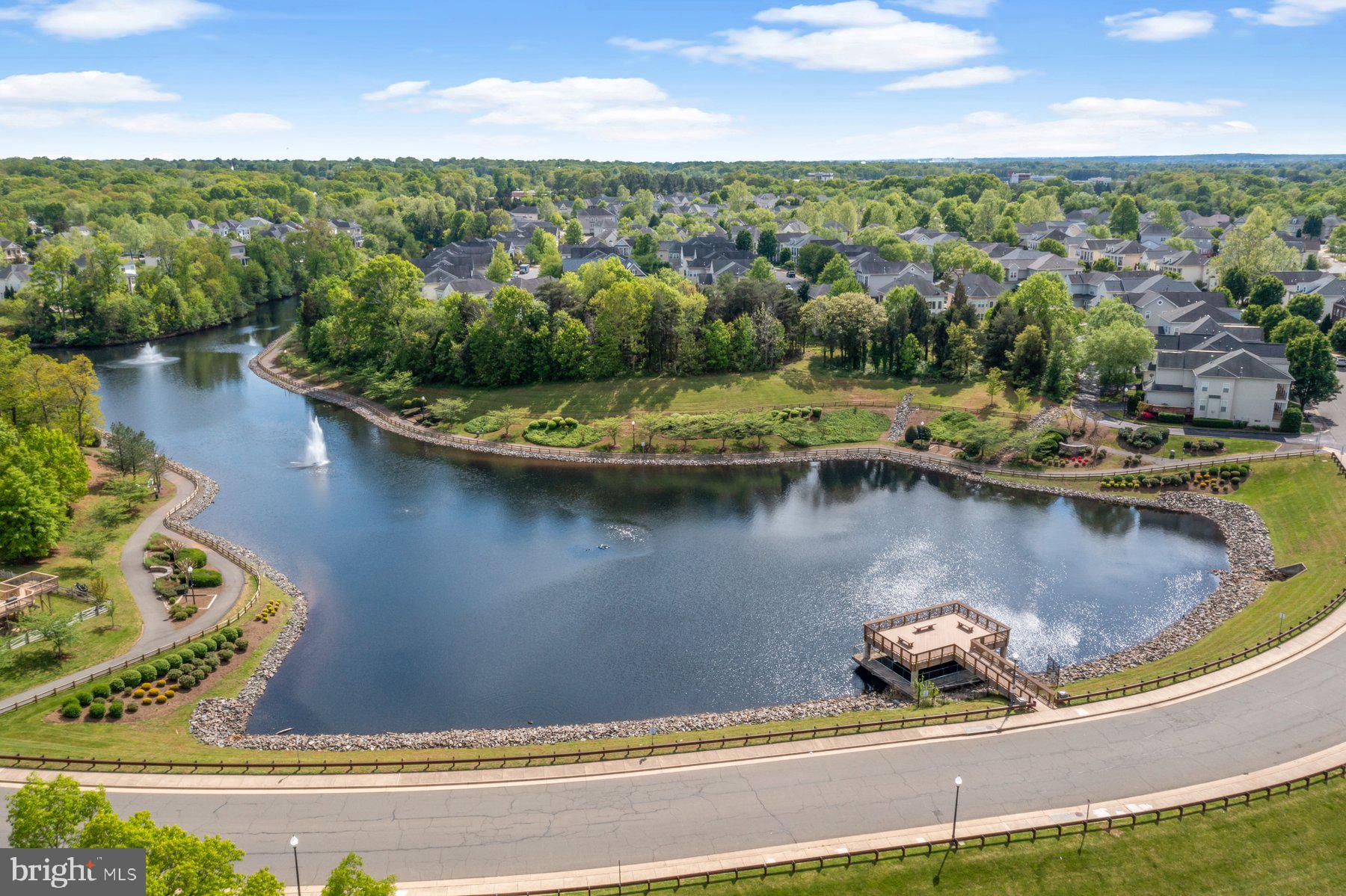 8329 Tillett Loop Manassas, VA 20110 - Photo 22 of 27 a view of a lake with a yard