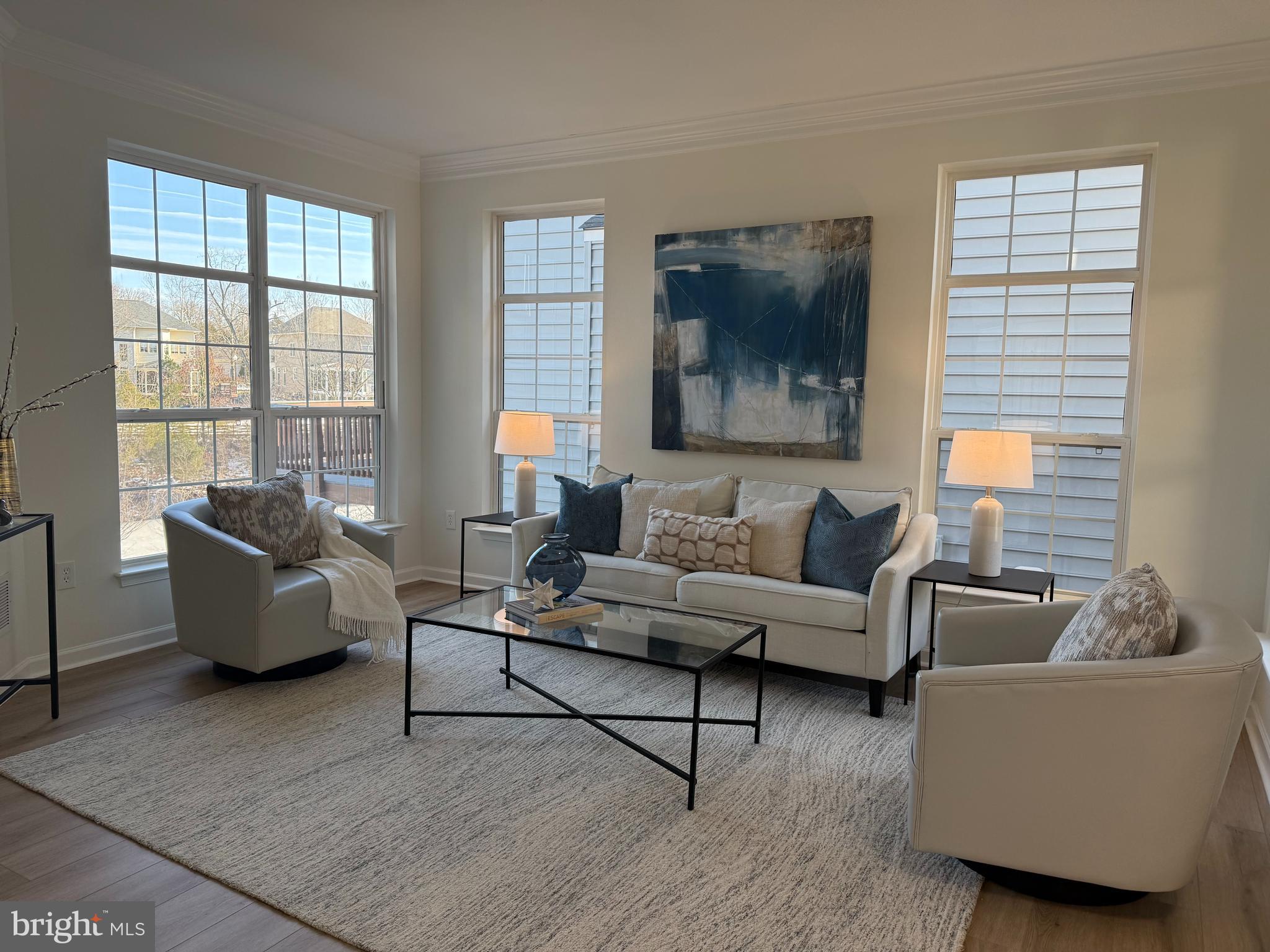 8329 Tillett Loop Manassas, VA 20110 - Photo 9 of 27 a living room with furniture and a window