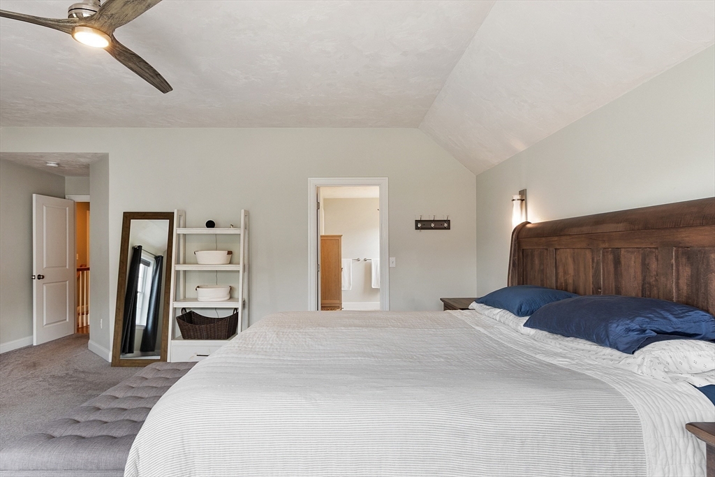 46 Jordan Road Holden, MA 01520 - Photo 19 of 42 a bedroom with a bed and a large mirror