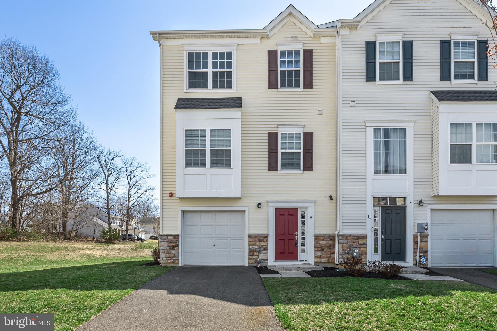 13 Iron Gate Road Sicklerville, NJ 08081 - Photo 1 of 25 a front view of a house with a yard