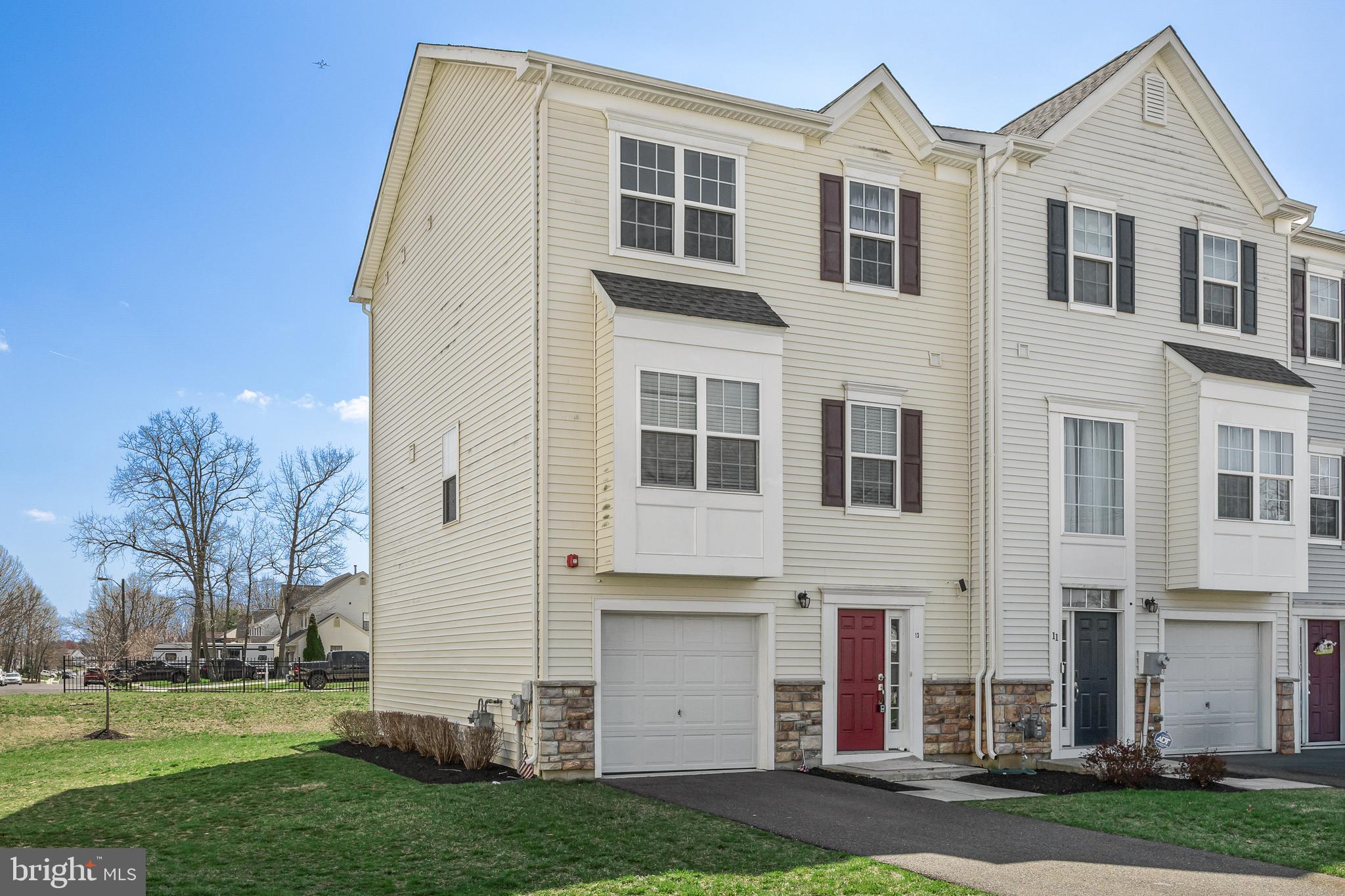 13 Iron Gate Road Sicklerville, NJ 08081 - Photo 2 of 25 a front view of a house with a yard
