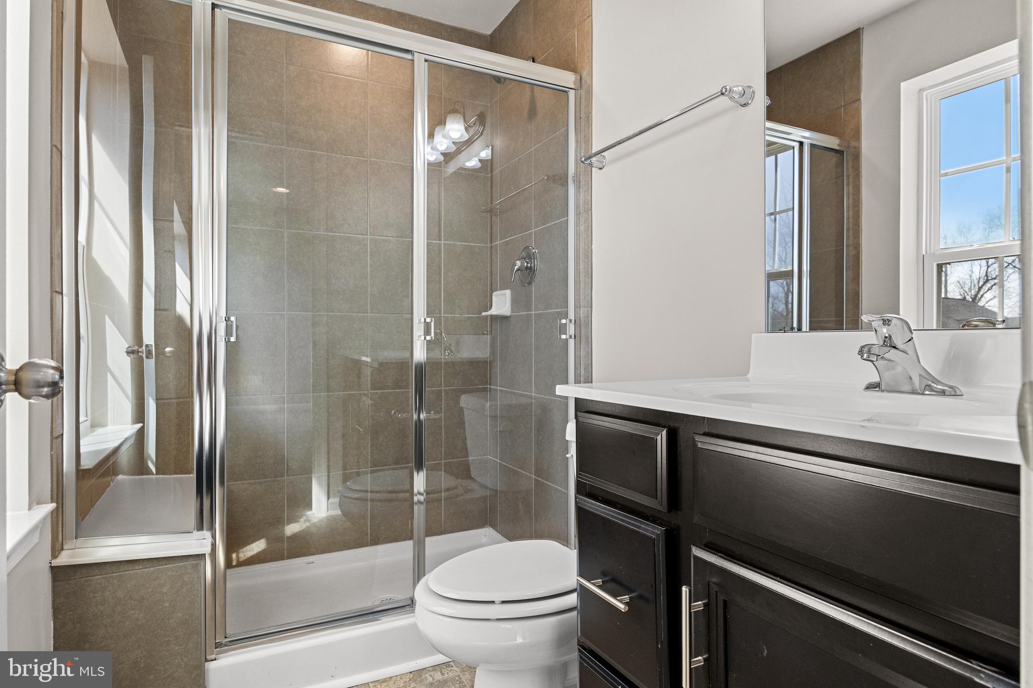 13 Iron Gate Road Sicklerville, NJ 08081 - Photo 23 of 25 a bathroom with a sink a toilet and shower