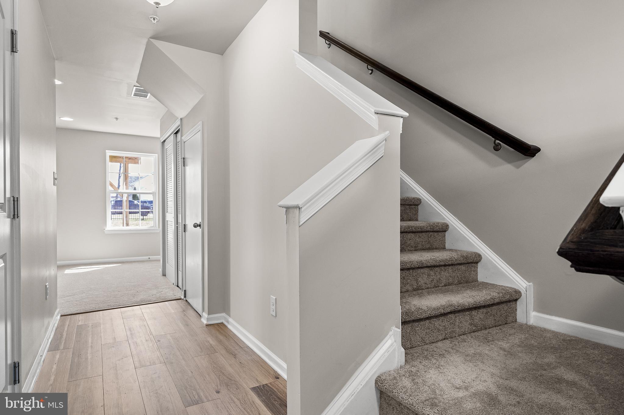 13 Iron Gate Road Sicklerville, NJ 08081 - Photo 4 of 25 a view of a hallway with wooden floor and staircase