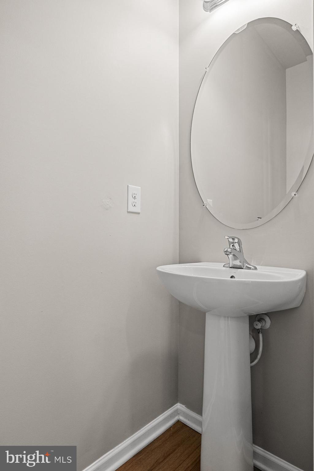 13 Iron Gate Road Sicklerville, NJ 08081 - Photo 10 of 25 a bathroom with a sink and mirror