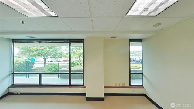 a view of a room with large windows