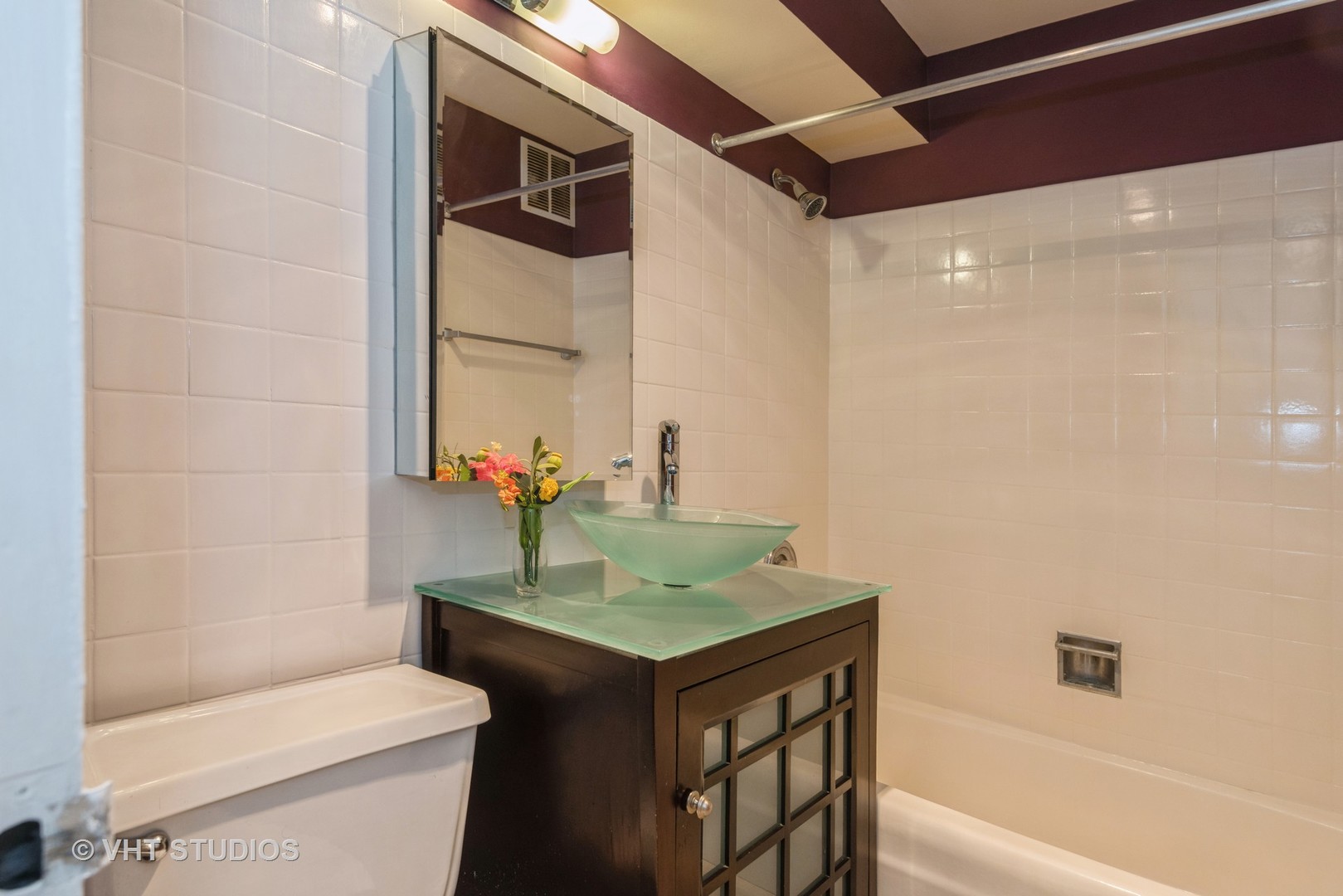 655 West Irving Park Road, Unit 1109 Chicago, IL 60613 - Photo 18 of 29 a bathroom with a sink toilet and shower