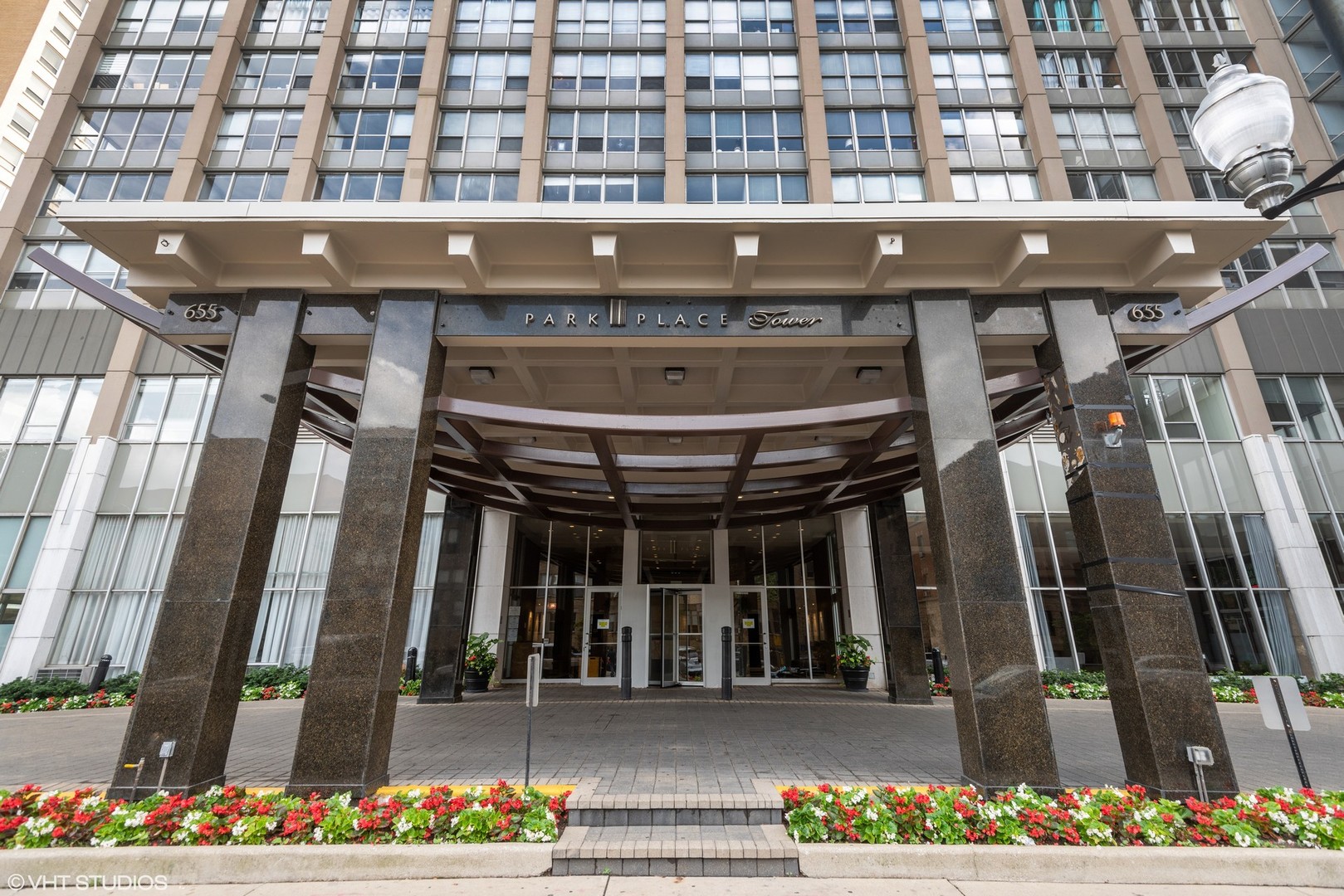 655 West Irving Park Road, Unit 1109 Chicago, IL 60613 - Photo 2 of 29 a front view of a building with glass windows