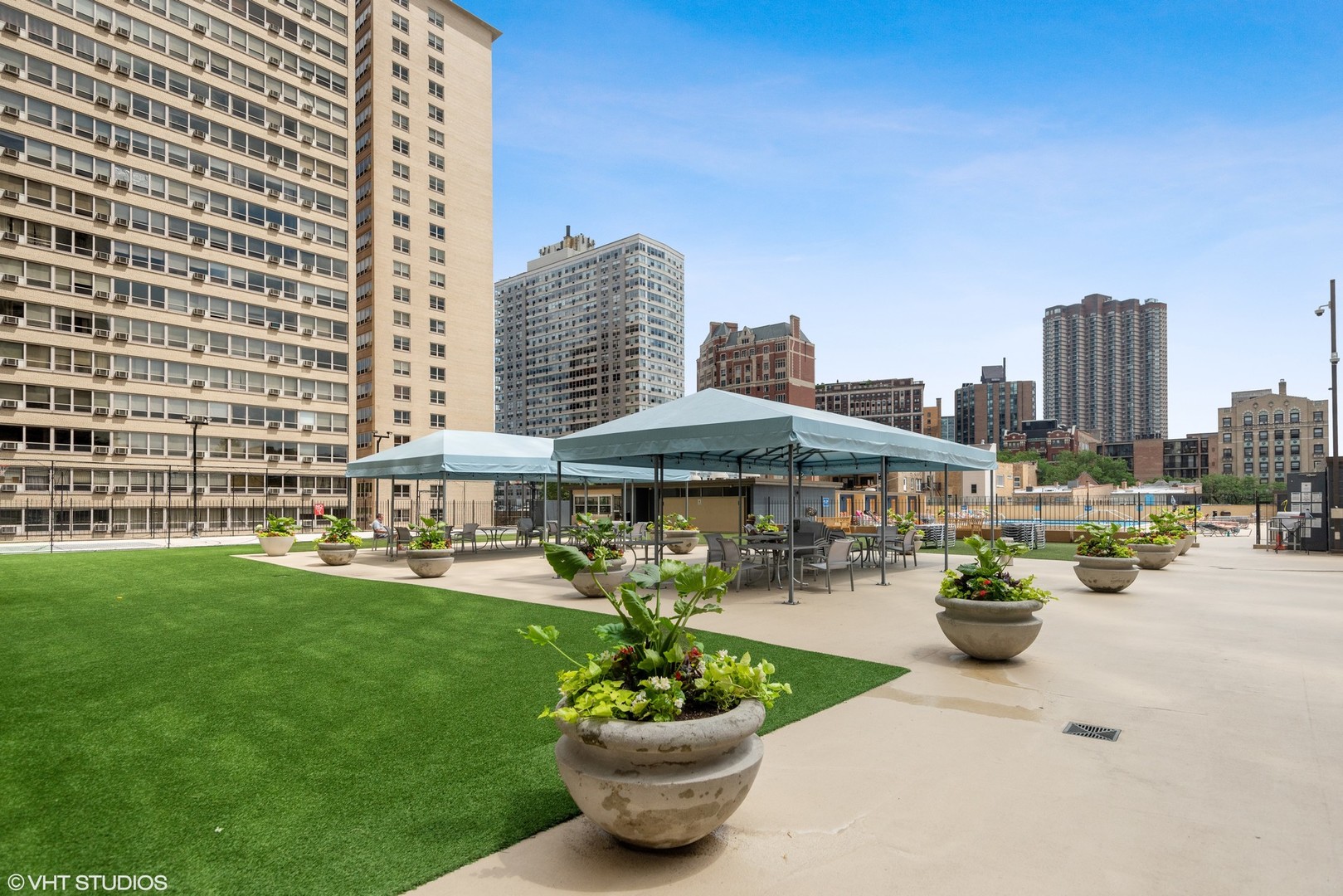 655 West Irving Park Road, Unit 1109 Chicago, IL 60613 - Photo 28 of 29 a view of a patio with couches and a table and chairs