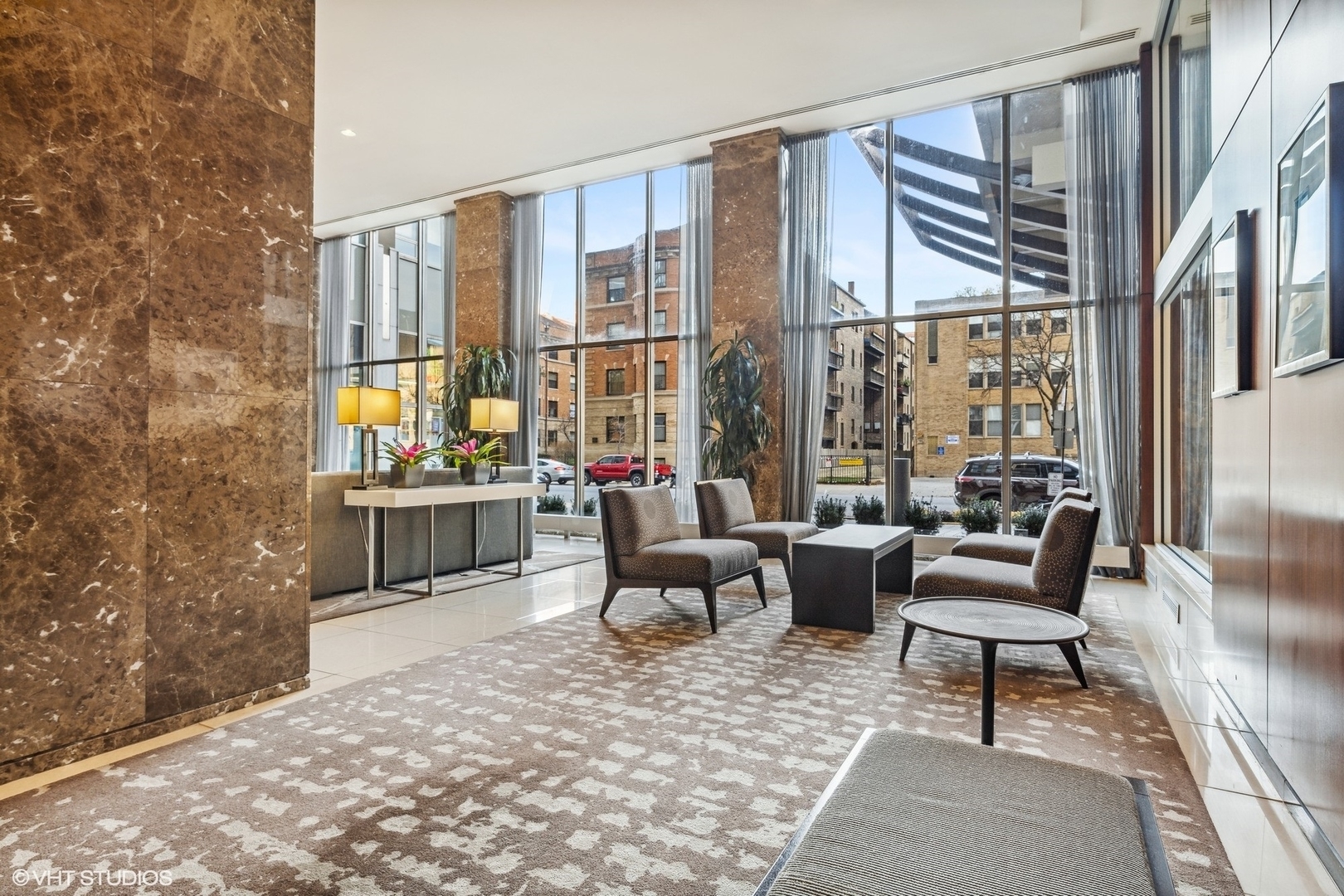 655 West Irving Park Road, Unit 1109 Chicago, IL 60613 - Photo 6 of 29 a living room with furniture and a large window