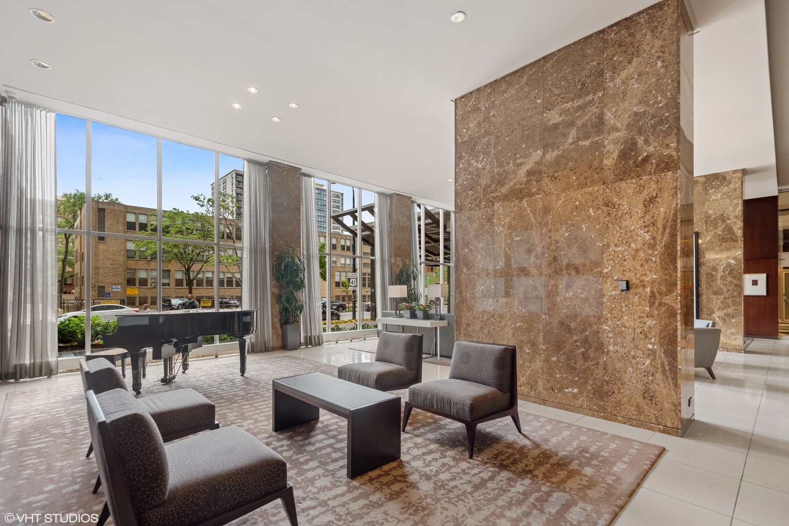 655 West Irving Park Road, Unit 1109 Chicago, IL 60613 - Photo 8 of 29 a living room with furniture and a large window