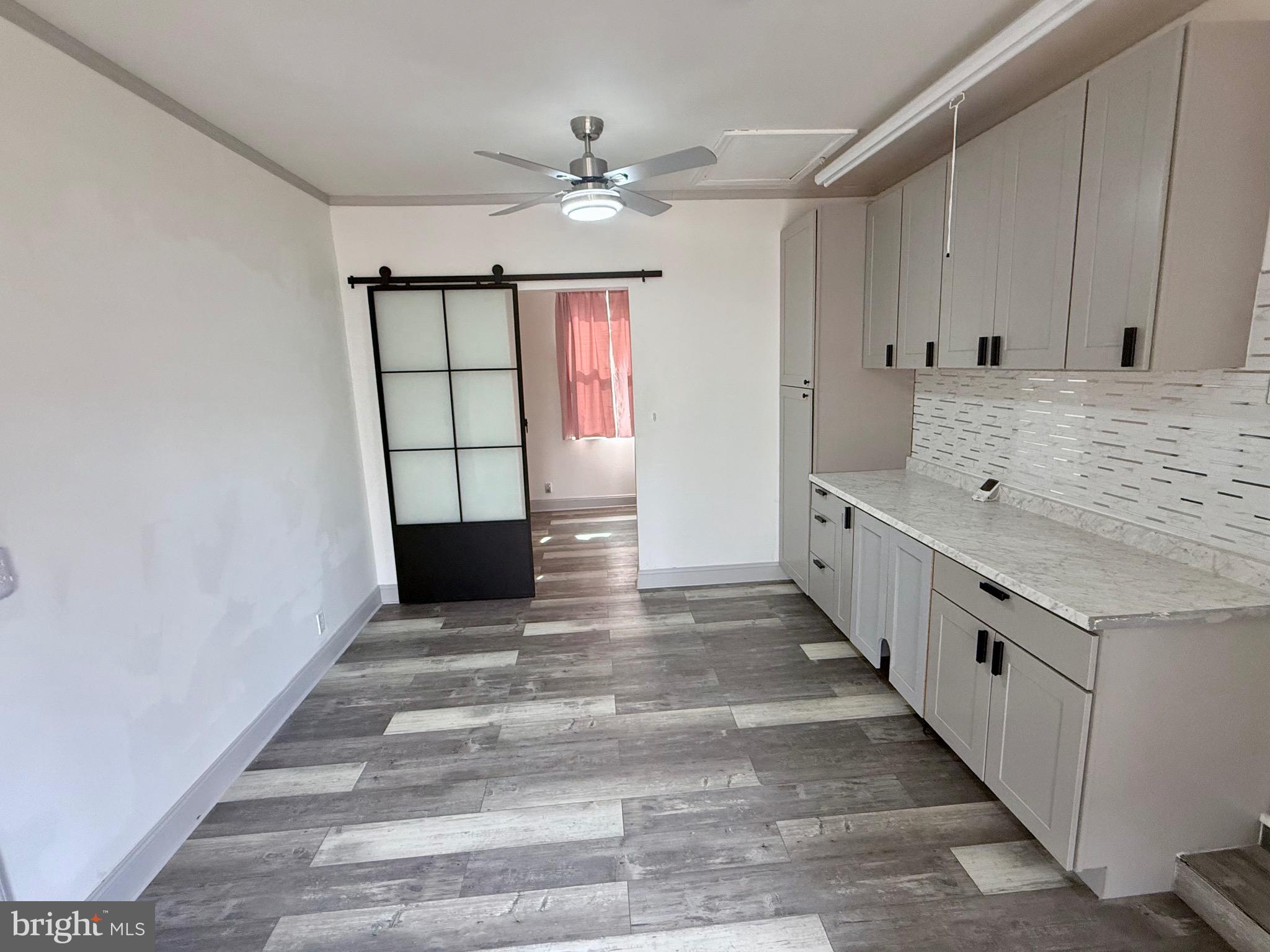 428 Buffalo Road Lusby, MD 20657 - Photo 14 of 20 a view of a kitchen with a sink and cabinets