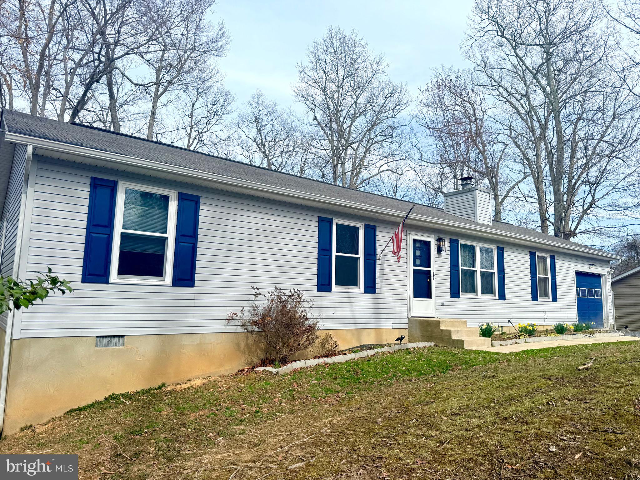 428 Buffalo Road Lusby, MD 20657 - Photo 2 of 20 a front view of a house with a yard