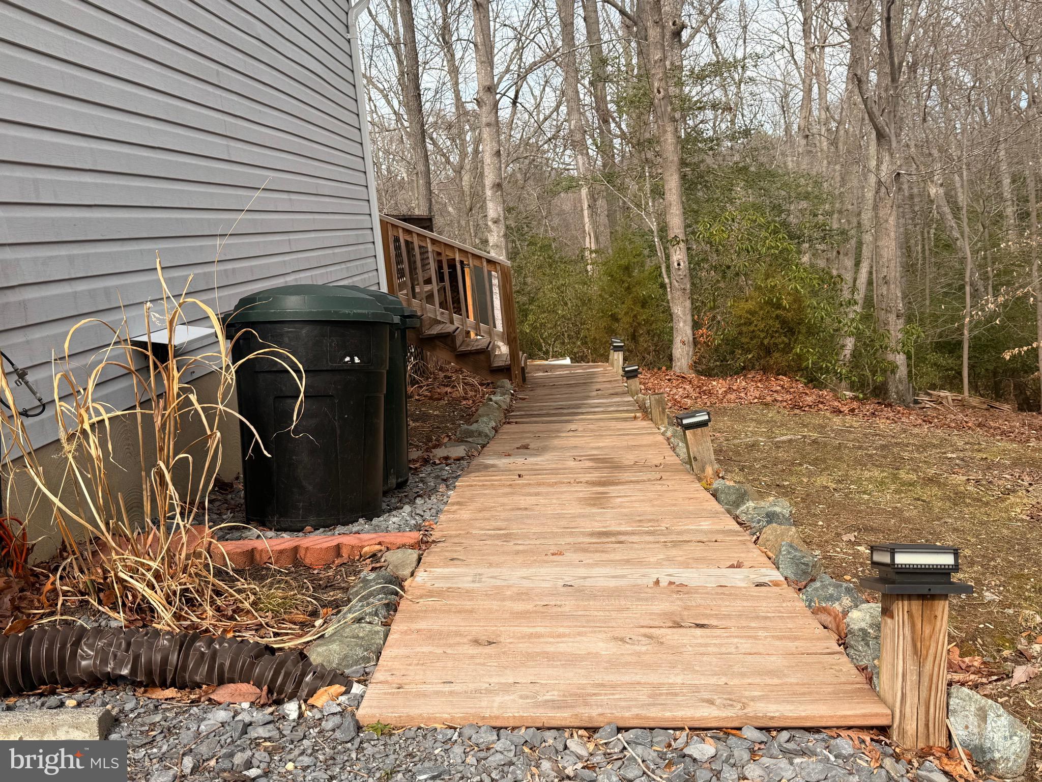 428 Buffalo Road Lusby, MD 20657 - Photo 4 of 20 a view of a backyard with pathway
