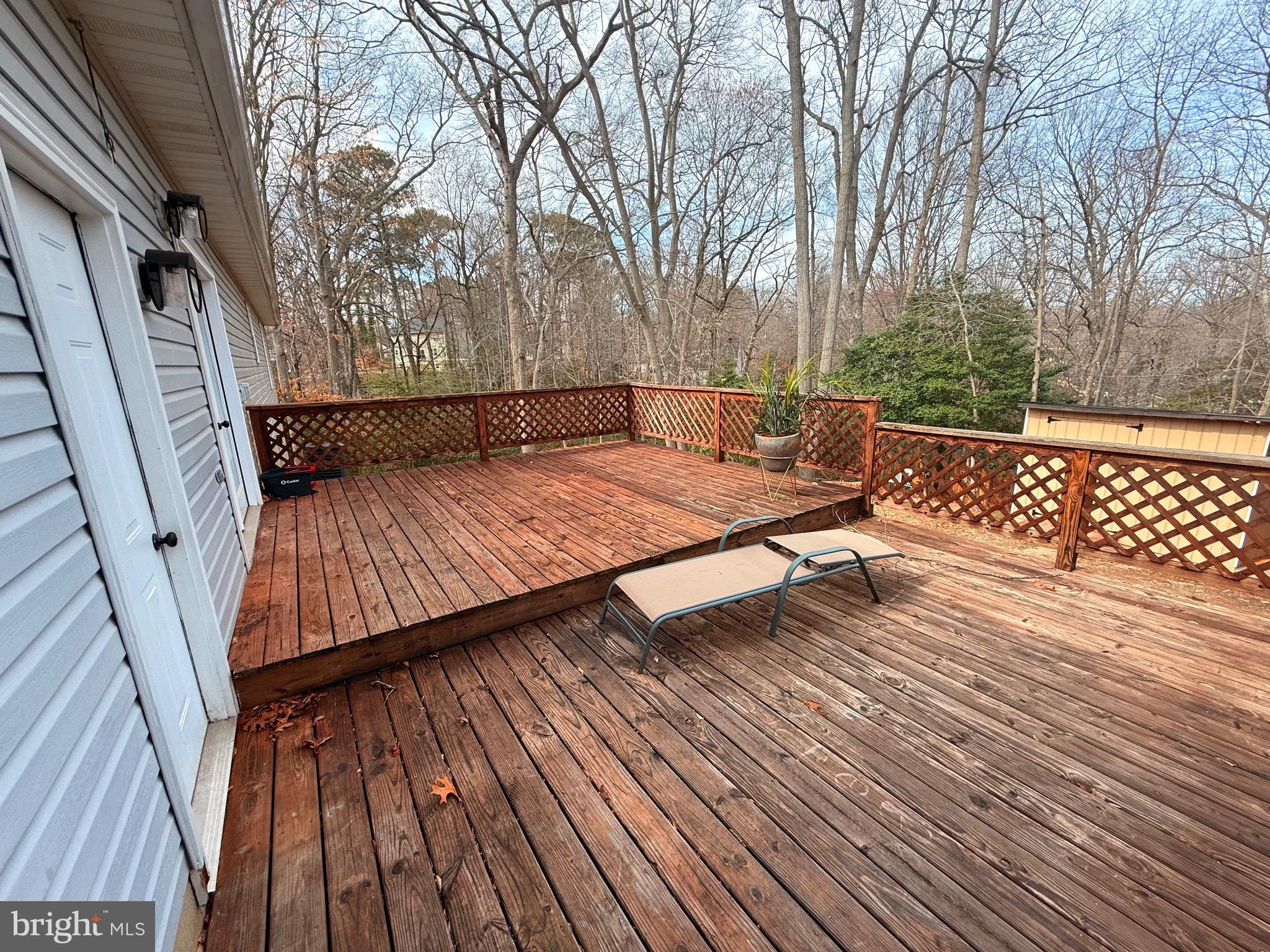 428 Buffalo Road Lusby, MD 20657 - Photo 6 of 20 a wooden deck with sunset view