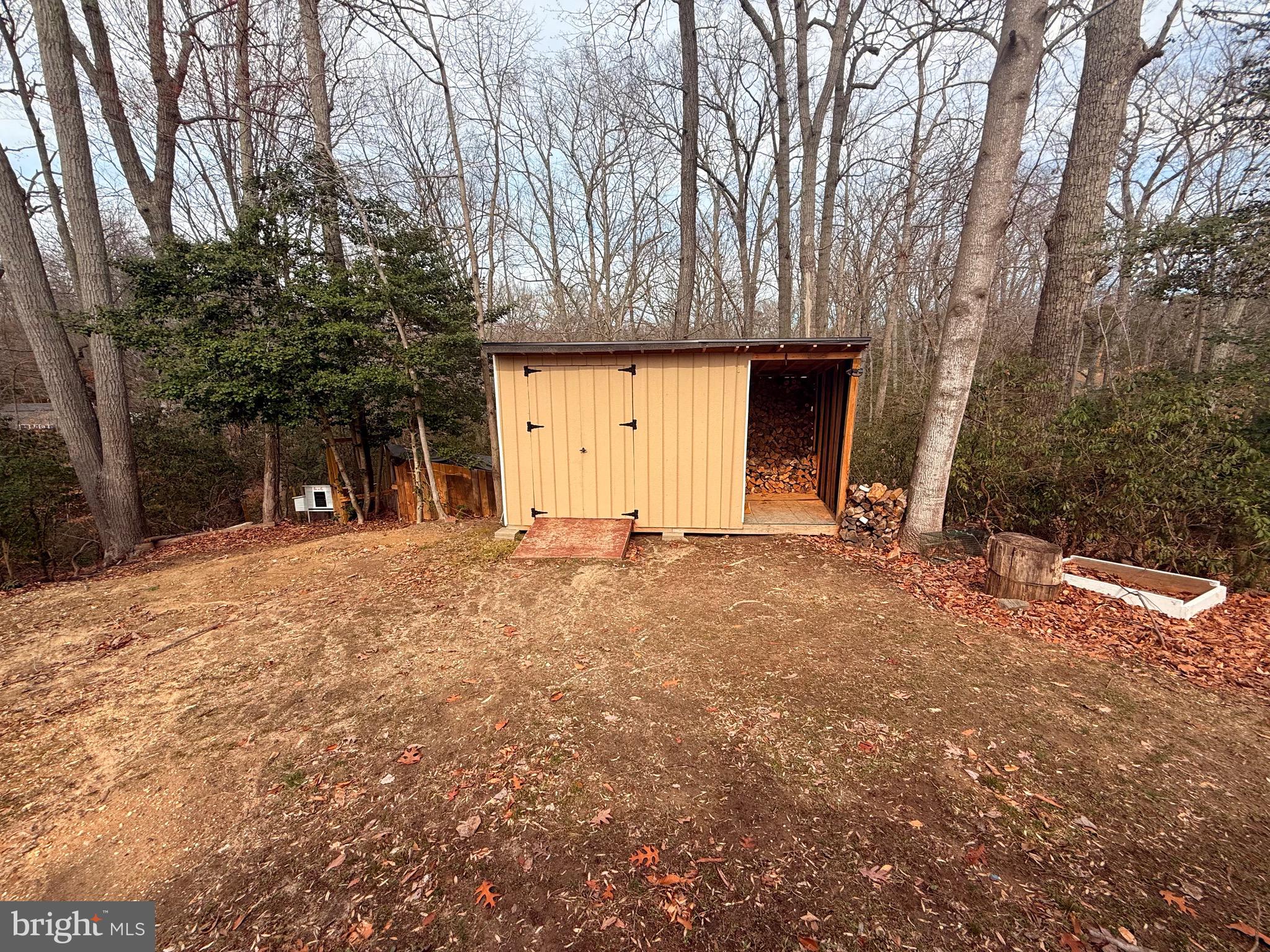 428 Buffalo Road Lusby, MD 20657 - Photo 7 of 20 a view of a house with a yard and garage