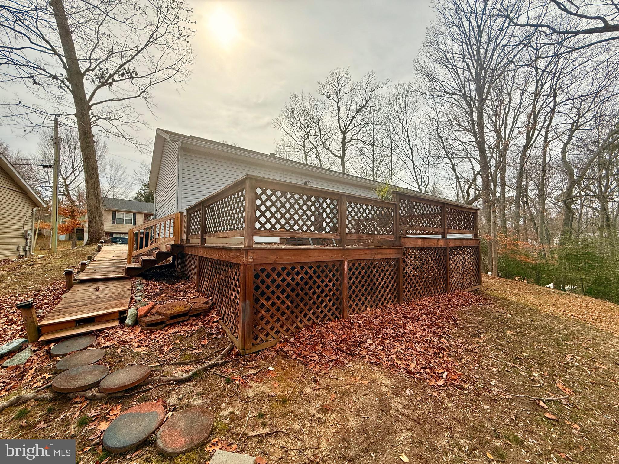 428 Buffalo Road Lusby, MD 20657 - Photo 8 of 20 a view of a house with a large tree