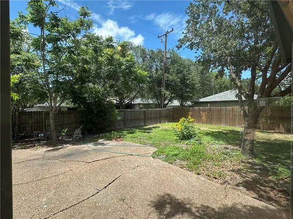a backyard of a house with lots of green space