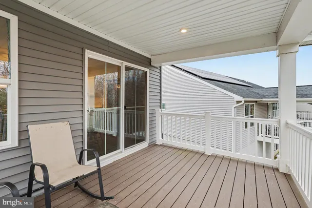 a view of a two chairs in the balcony