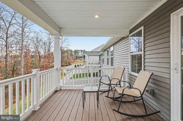 a bedroom with a bed a chandelier and closet