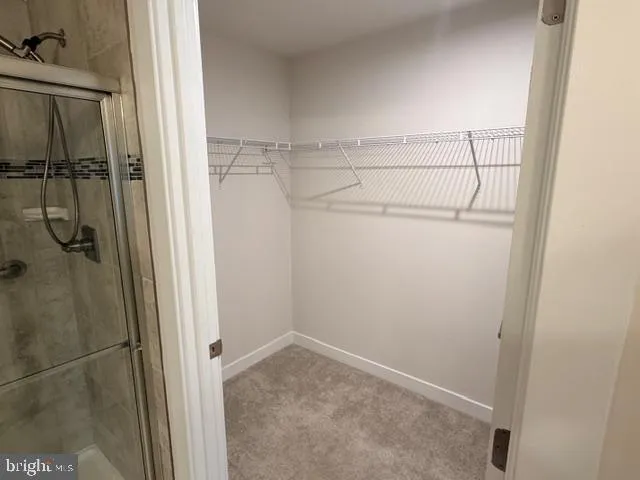 a bedroom with bed and window