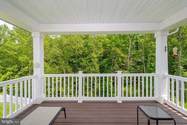 a view of a wooden chair in a balcony