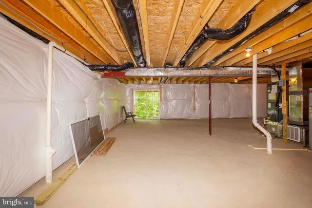 a view of a backyard with table and chairs and potted plants