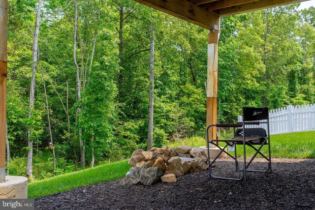 a front view of a house with a yard outdoor seating and yard