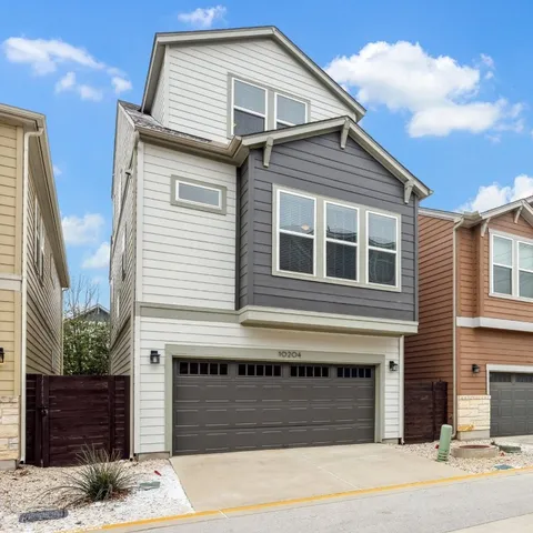 a front view of a house with a garage