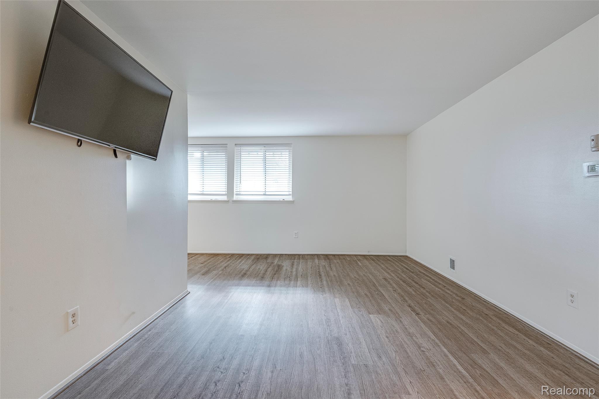 29860 West 12 Mile Road, Unit 604 Farmington, MI 48334 - Photo 9 of 26 Empty room with wood finished floors