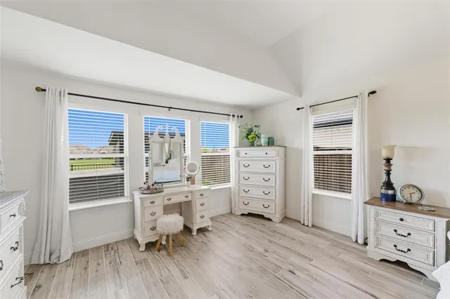a room with fireplace closet and a window