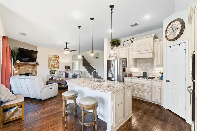 a very nice looking dining room with a table chairs and a wooden floor