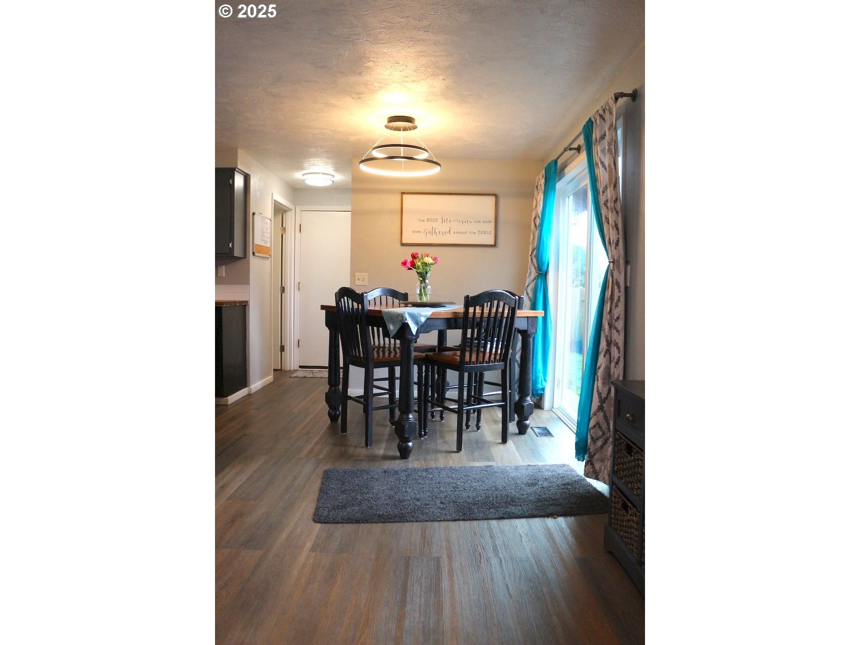 2172 8th Street Springfield, OR 97477 - Photo 11 of 34 a view of a dining room with furniture and chandelier