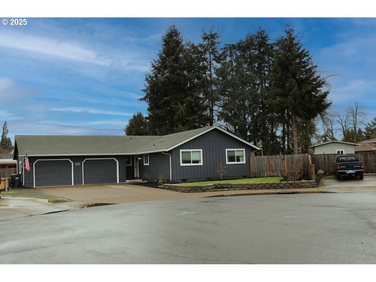 2172 8th Street Springfield, OR 97477 - Photo 2 of 34 a view of a yard in front of a house with large trees