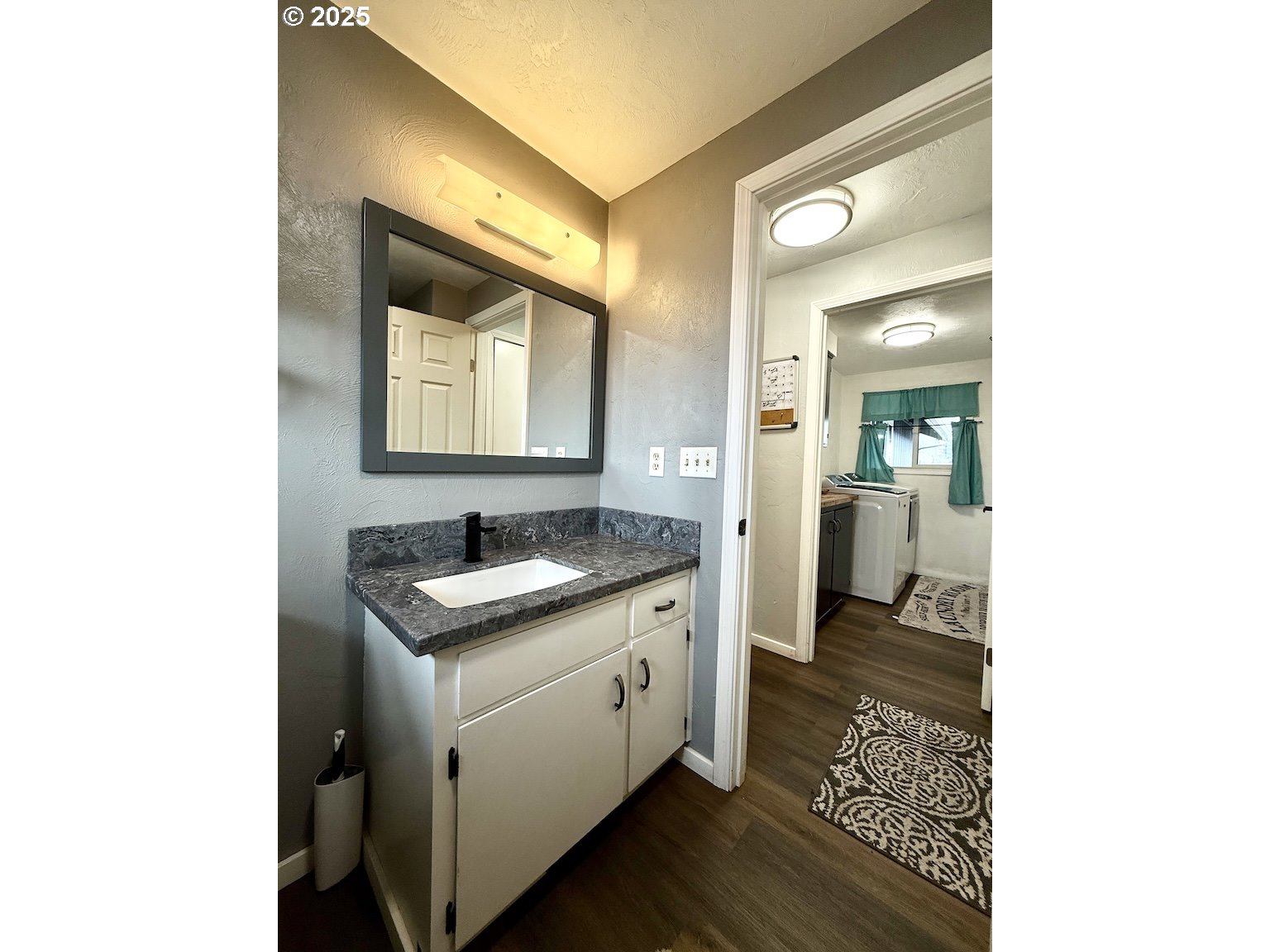 2172 8th Street Springfield, OR 97477 - Photo 22 of 34 a bathroom with a granite countertop sink and a mirror