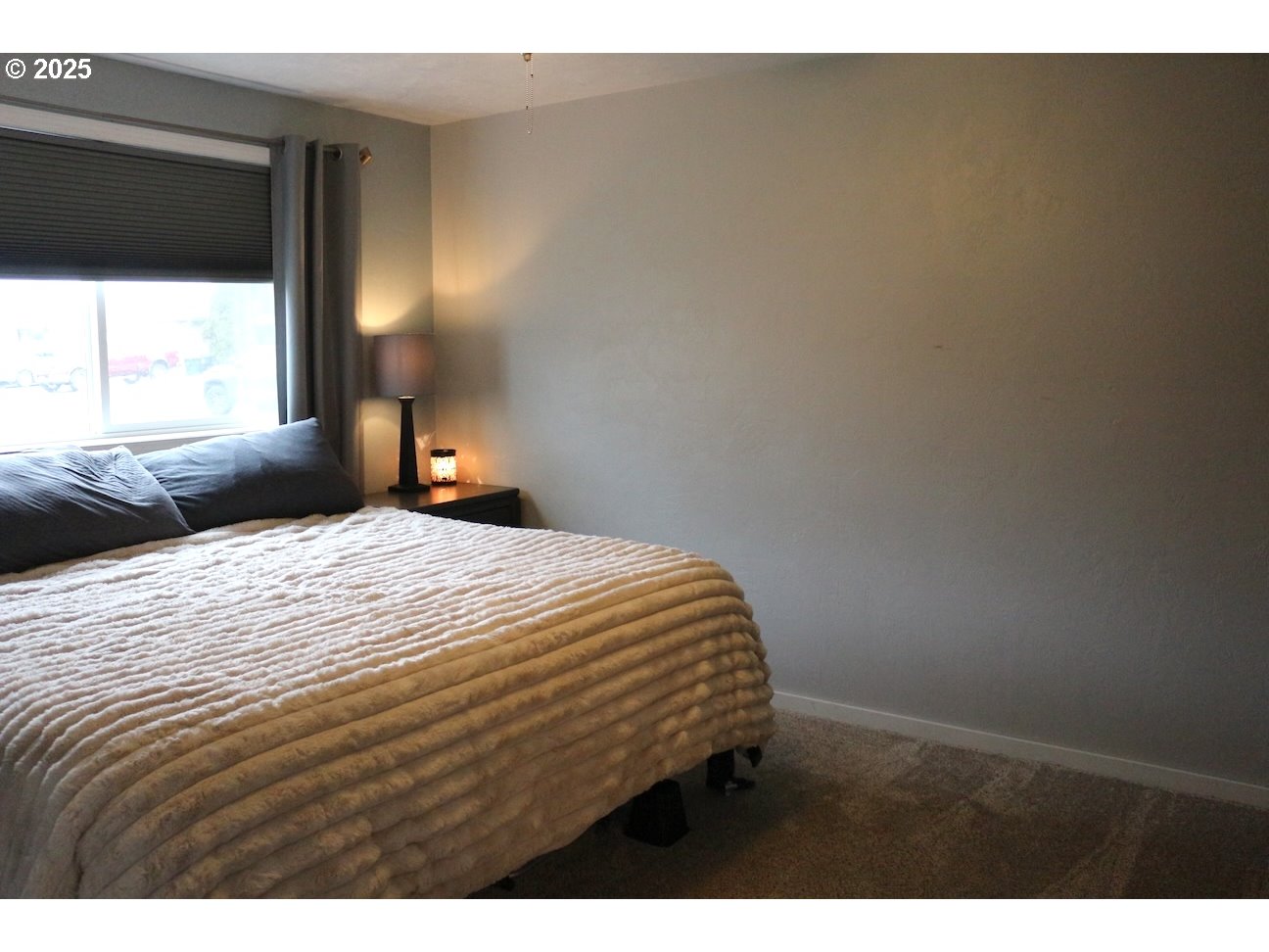 2172 8th Street Springfield, OR 97477 - Photo 30 of 34 a bedroom with a bed and a window