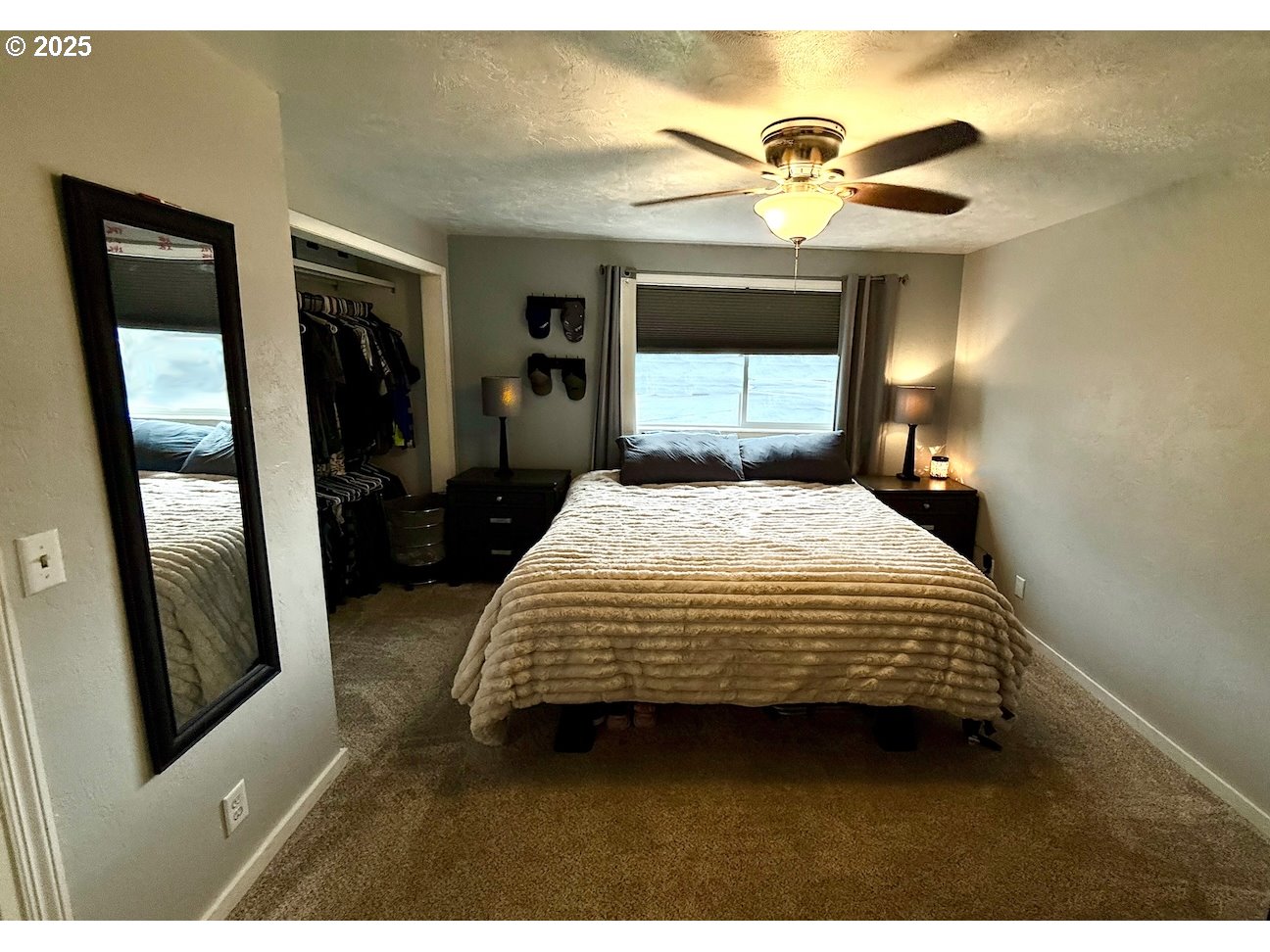 2172 8th Street Springfield, OR 97477 - Photo 31 of 34 a bedroom with a bed and a mirror