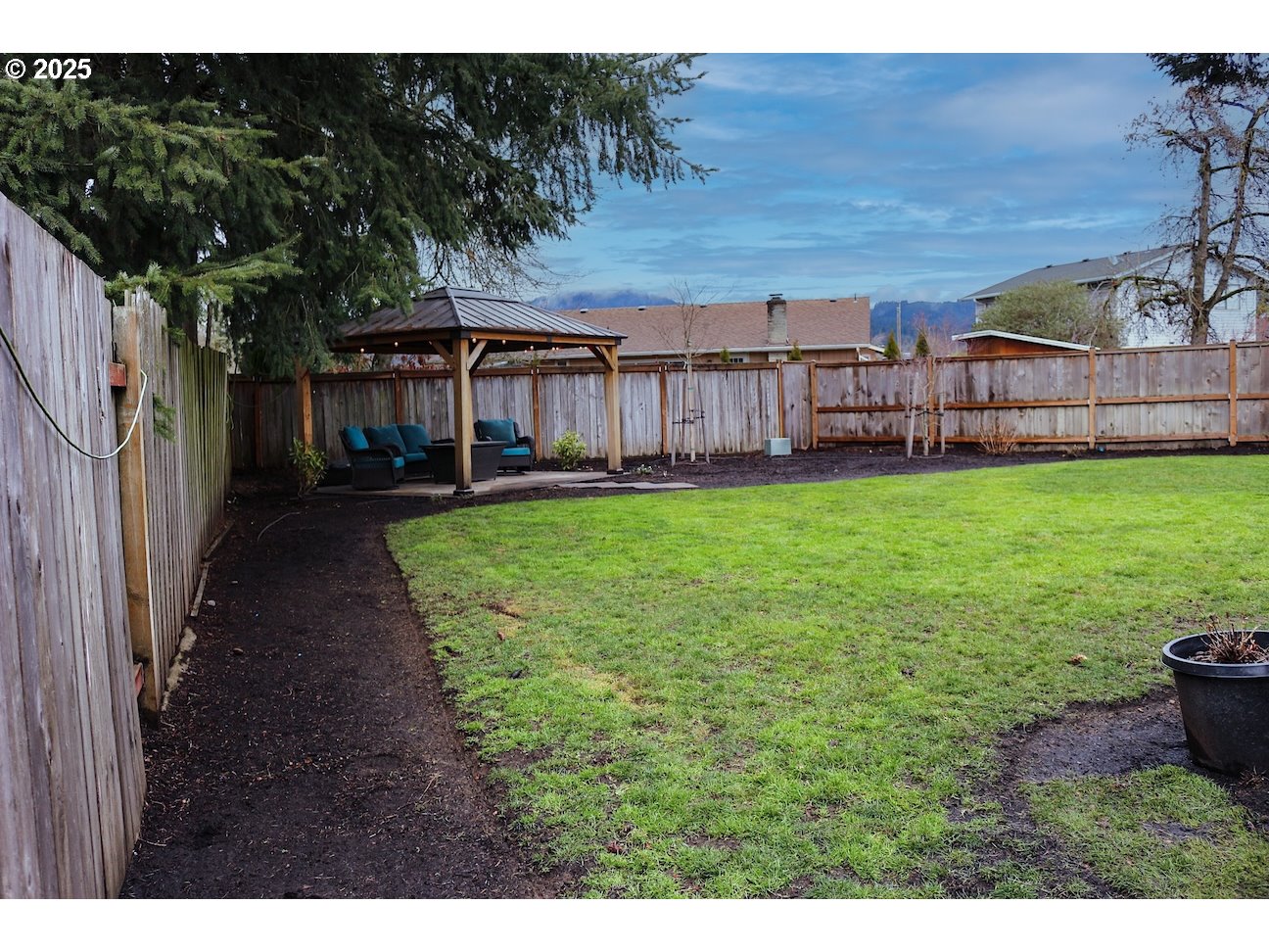 2172 8th Street Springfield, OR 97477 - Photo 32 of 34 a view of a yard with wooden fence
