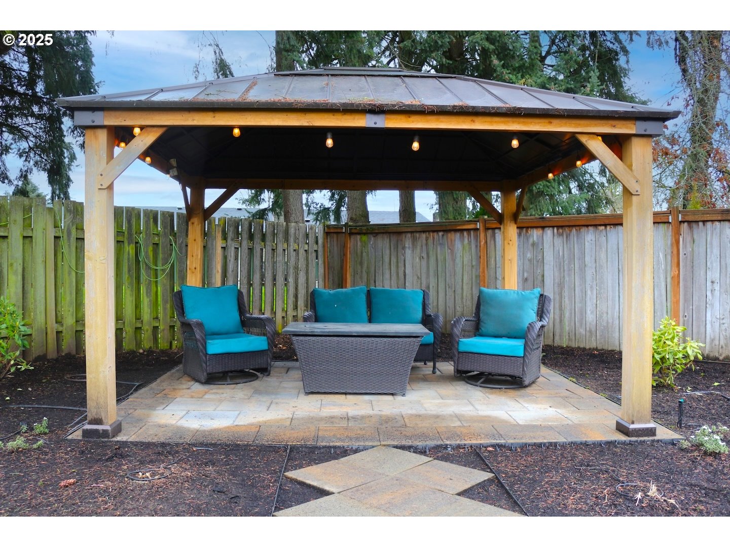 2172 8th Street Springfield, OR 97477 - Photo 34 of 34 a view of patio with a table and chairs under an umbrella