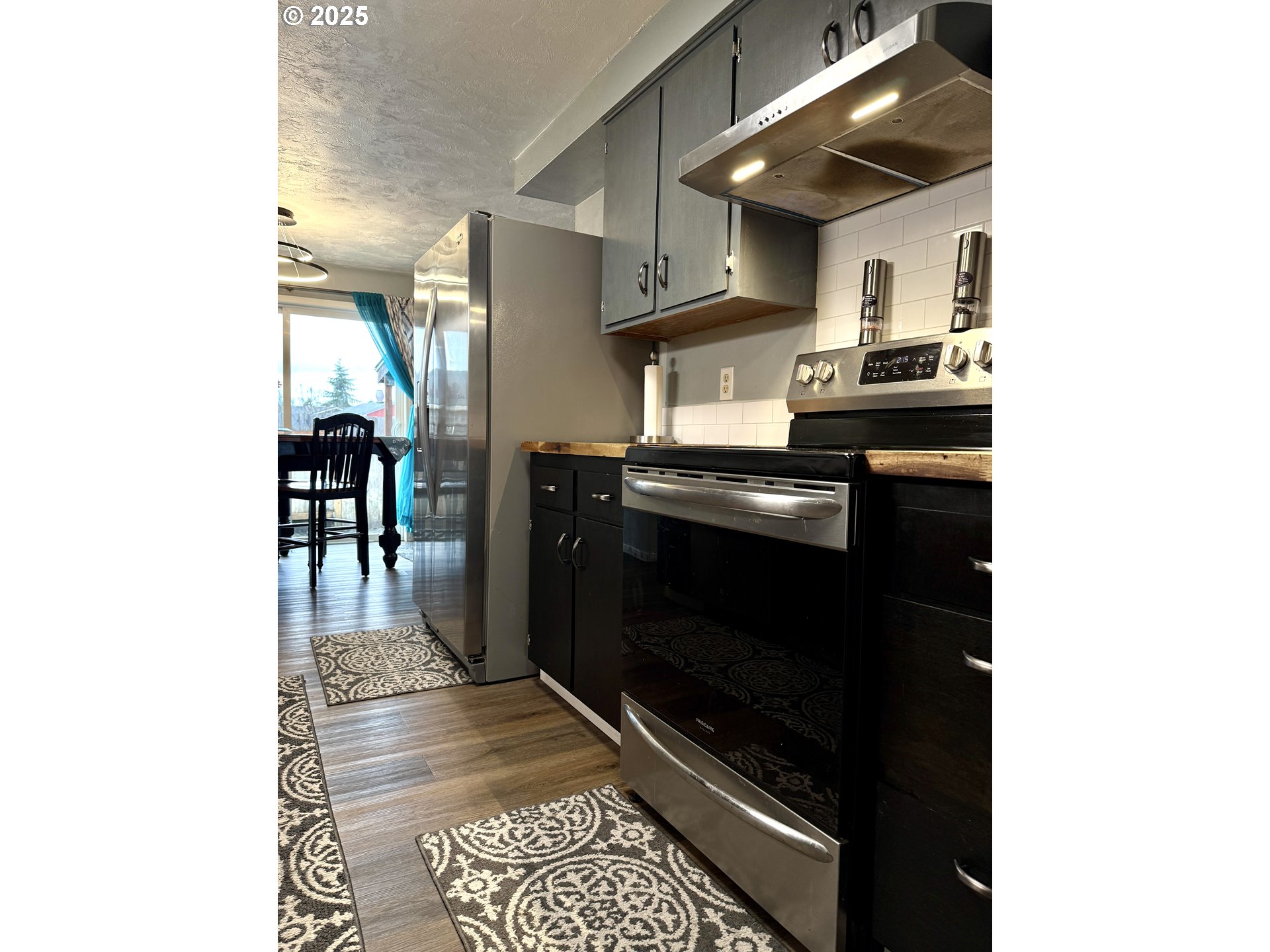 2172 8th Street Springfield, OR 97477 - Photo 5 of 34 a kitchen with a stove and a refrigerator