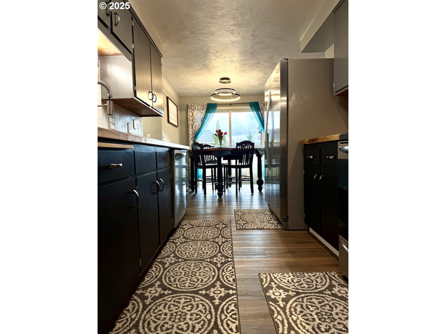 2172 8th Street Springfield, OR 97477 - Photo 9 of 34 a view of a hallway with wooden floor