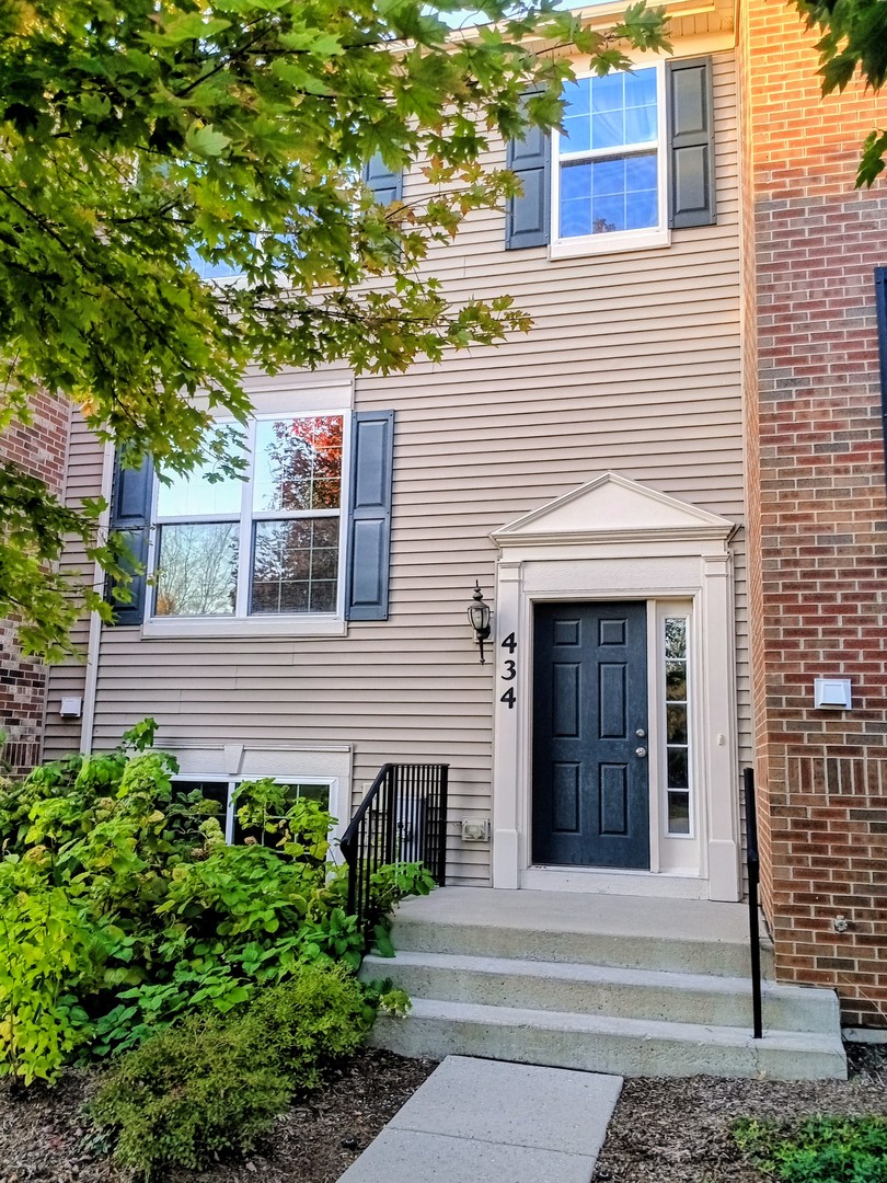 a house with a tree in front of it