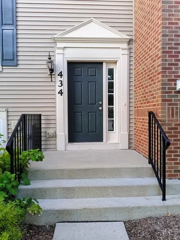 a front view of a house with a garage