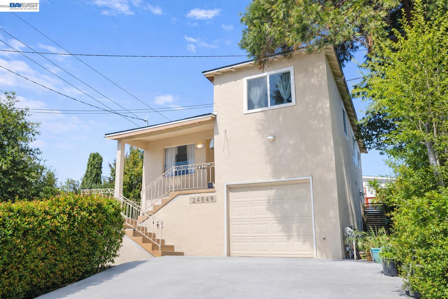 24849 2nd Street Hayward, CA 94541 - Photo 2 of 24 a front view of a house with a yard and garage